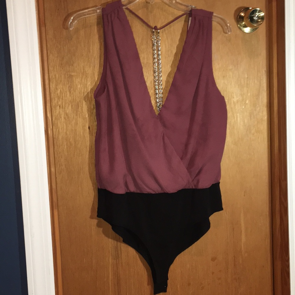 Blush low-cut front and open back body suit